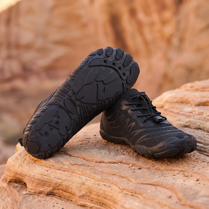 Pure Black water trekking shoes on warm sandstone rock